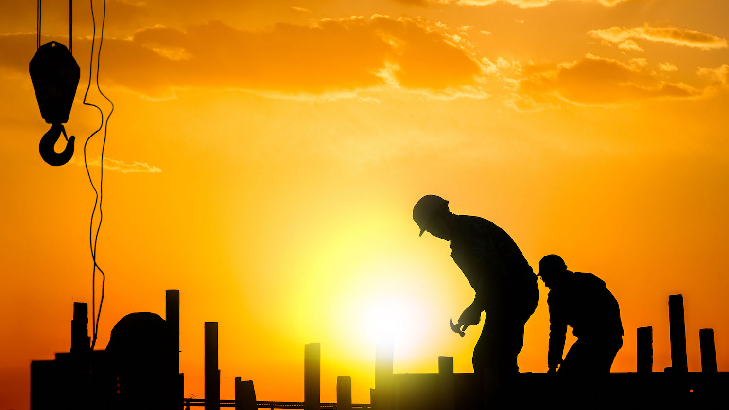 construction workers at sunset: dreamstime