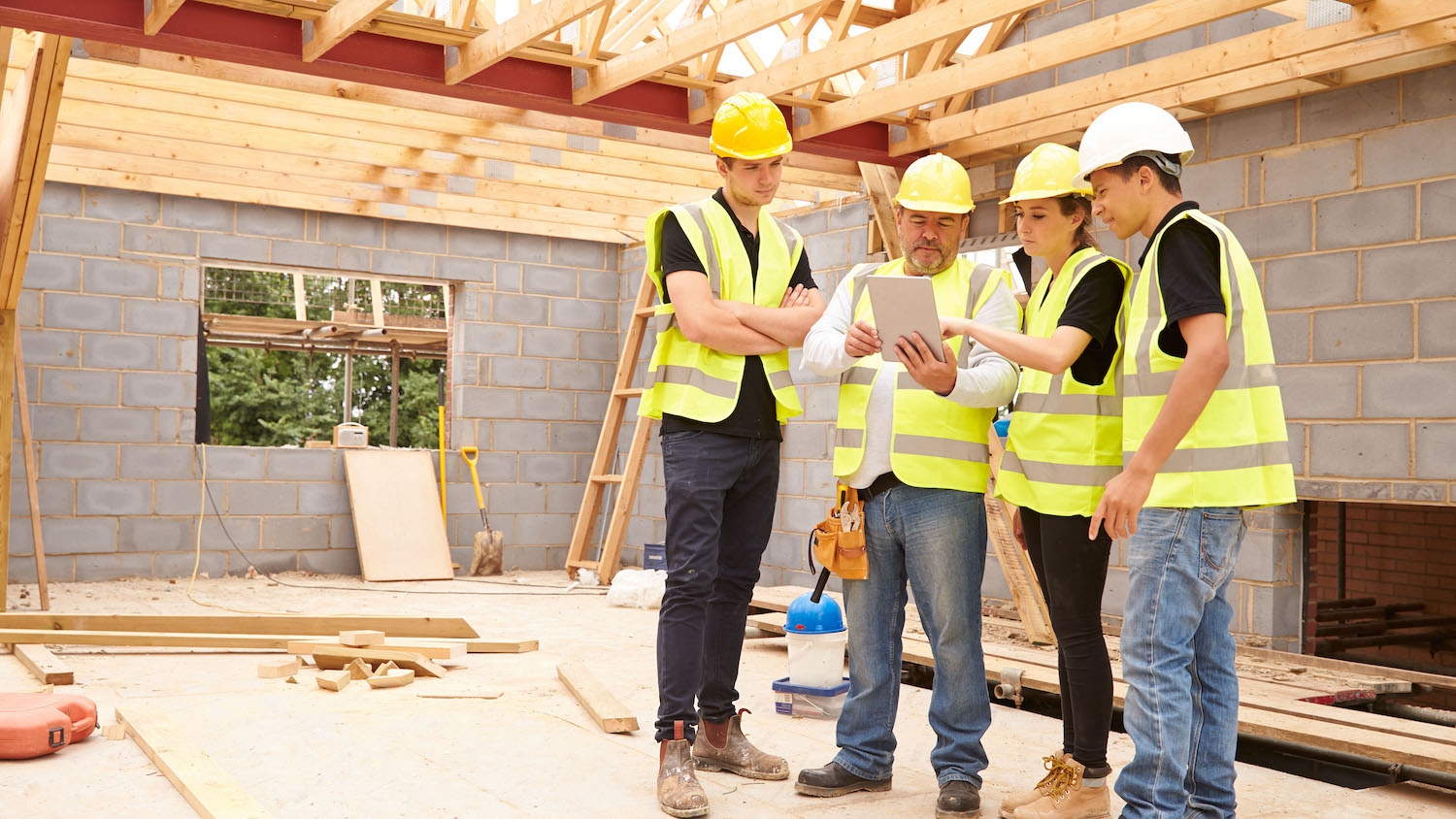 apprentices learning on site, dreamstime