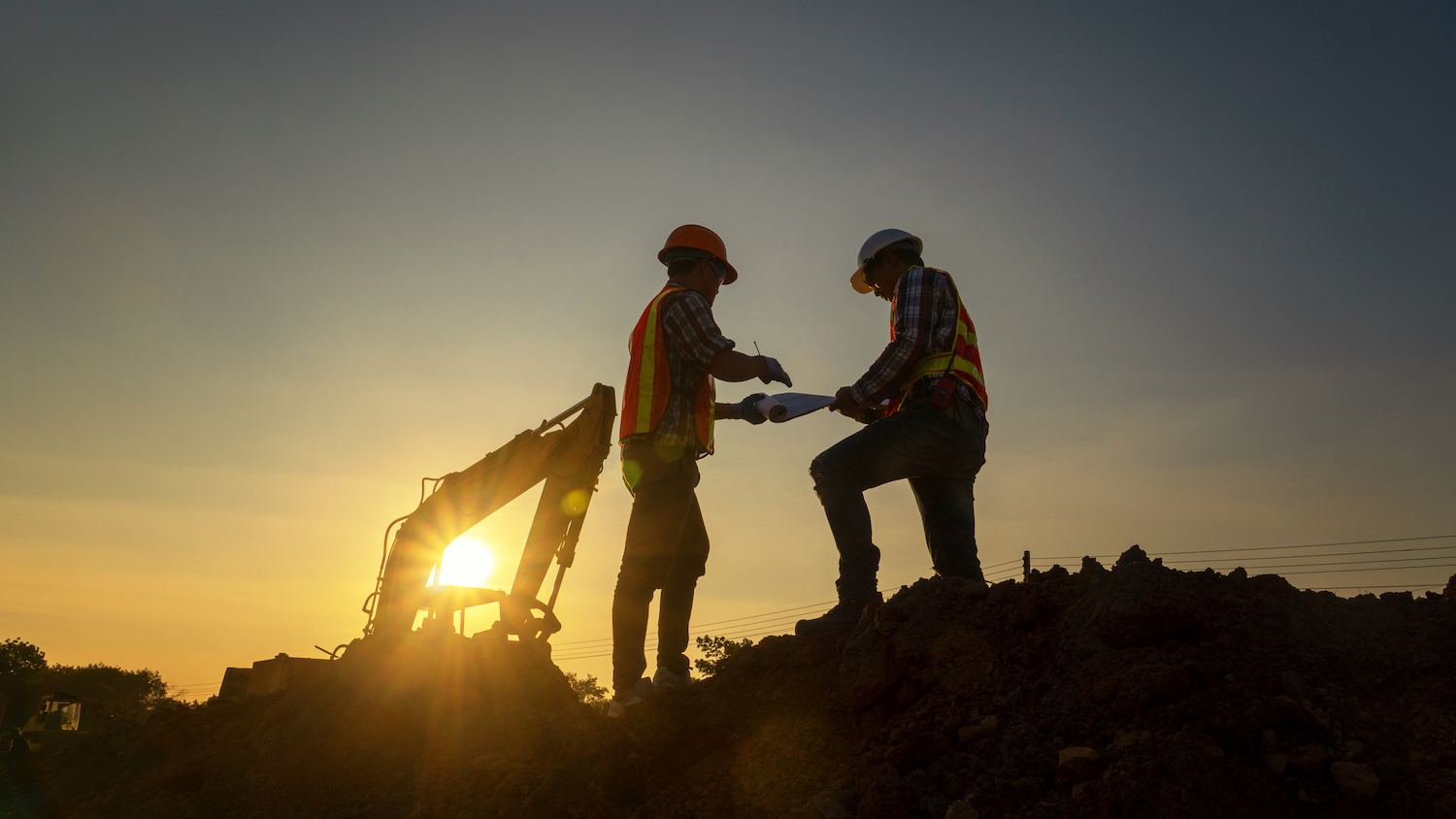 construction scene at sunset, dreamstime